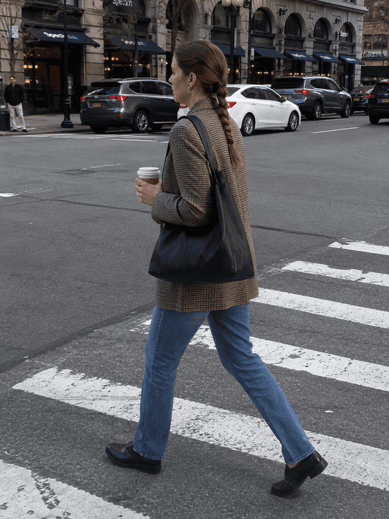 Braided ponytail staying tidy during a busy city morning commute