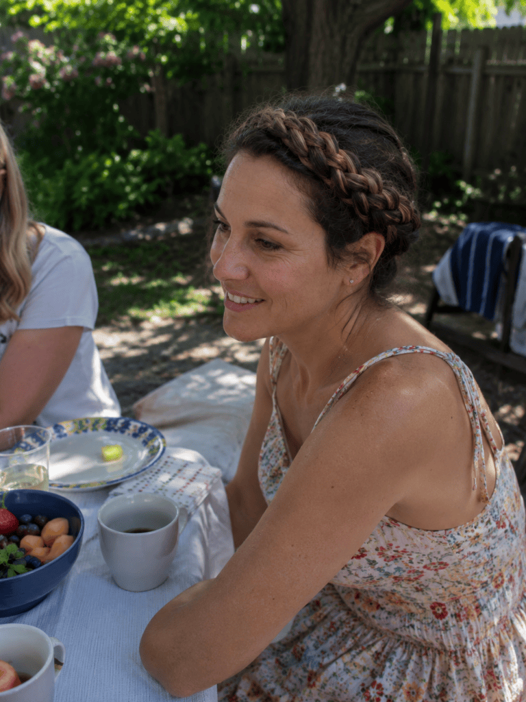 Halo crown braid hairstyle at a relaxed outdoor weekend brunch